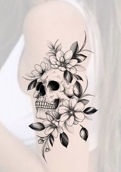 a skull with flowers on it's head is shown in black and white ink