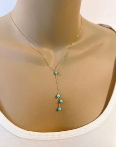 Dainty Turquoise Bead Lariat Necklace Simple necklace is composed of delicate cable chain with 4mm genuine turquoise beads and spring ring closure. All metal components are 14K gold filled, rose gold filled or sterling silver.  The lengths listed are excluding the drop (chain going around the neck to the Y).  The drop at the Y is an additional 2 inches. CUSTOM REQUESTS ARE ALWAYS WELCOME! ~ Feel free to message me if you have any questions or special requests ... I will do my best to accommodate Turquoise Drop Necklace, Turquoise Lariat Necklace With Beaded Chain, Turquoise Beaded Chain Lariat Necklace, Turquoise Lariat Necklace With Adjustable Chain, Pearl And Turquoise Necklace, Dainty Blue Turquoise Necklace With Adjustable Chain, Turquoise Lariat Necklace Gift, Turquoise Lariat Necklace As A Gift, Elegant Turquoise Lariat Necklace With Adjustable Chain