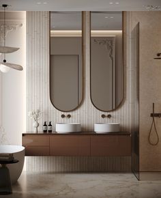 a bathroom with two sinks and three mirrors on the wall next to a bathtub