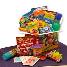 a bag filled with lots of different types of candy and candies on top of a table