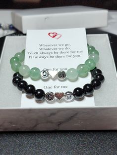 "Personalized set of gemstone bracelets for couples Remind yourself of the special relationships you have with those that you adore with these inital couples/distance bracelets. Each set comes in a complimentary gift box with a note that reads: \"Wherever we go, Whatever we do, You'll always be there for me I'll always be there for you. One for you One for me\" Perfect for gift giving ; Christmas, Valentine's day, Birthday, long distance relationships or just friendships Bracelets are made with high quality, AAA grade genuine natural semi-precious 8mm gemstones, and include a magnetic clasp to attach to one another.  2 initial beads separated by a small heart bead. (specify the two initials in the personalization)   Your choice of gold or silver settings Available in several sizes.  Measur Couples Black Bracelets For Best Friend Gift, Black Couples Bracelets For Best Friend Gift, Elegant Black Name Bracelet For Gift, Elegant Black Name Bracelet As Gift, Black Bracelet Jewelry For Best Friend Gift, Personalized Black Beaded Bracelets For Couples, Personalized Black Jewelry For Best Friend Gift, Black Couples Jewelry Gift, Black Couples Bracelet Jewelry