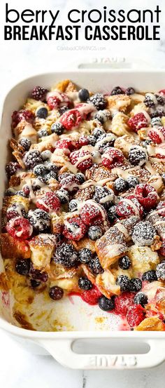 berry croissant breakfast casserole in a white dish with the title above it