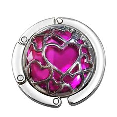 a pink glass and chrome plate with hearts on it