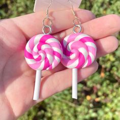 Cute pair of pink lollipop earrings.  Made of clay in pink & white.  Sterling silver hooks.  Perfect candy themed accessory.  Other similar items in my store 🍭 Candy Themed Accessories, Nickel-free Pink Earrings For Birthday, Fun Pink Polymer Clay Earrings, Sweet Pink Drop Earrings, Whimsical Pink Nickel-free Earrings, Whimsical Nickel-free Pink Earrings, Pink Novelty Dangle Jewelry, Pink Fun Dangle Jewelry, Fun Pink Dangle Jewelry