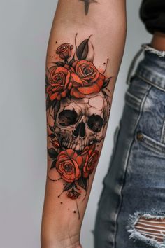 a woman's arm with roses and a skull on it