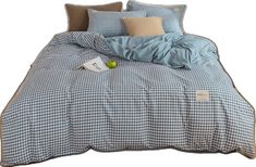 a blue and white checkered comforter with pillows