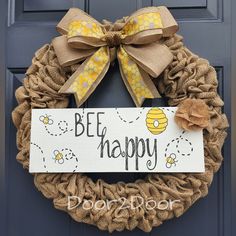 a bee happy door hanger hanging on a front door