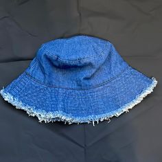 One Size Denim Distressed Bucket Hat. Never Worn Blue Denim Bucket Hat For Summer, Blue Denim Sun Hat With Curved Brim, Summer Denim Hat In Medium Wash, Denim Bucket Hat With Short Brim For Beach, Blue Denim Bucket Hat, Medium Wash Denim Bucket Hat For Beach, Medium Wash Denim Bucket Hat For The Beach, Summer Washed Blue Denim Hat, Denim Blue Cotton Hat For Beach