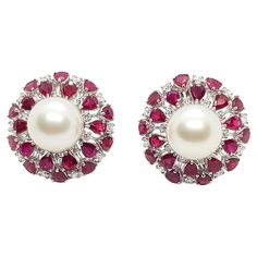 South Sea Pearl with Ruby 8.0 carats and Diamond 1.30 carats Earrings set in 18 Karat White Gold Settings Width: 2.6 cm Length: 2.6 cm Total Weight: 24.46 grams "We first opened doors in 1980 when it was then situated in the vicinity of the Victory Monument; a small and modest storefront with a couple of counters. From its humble beginnings to where it stands today, our company has proven its abilities as a jeweler. Since the beginning, we have been supplying fine quality pieces to dealers, wholesalers and customers worldwide. From then till now, our business still interrelates its name with quality products and excellent service, where commitment and sincerity toward customers will always be its motto." Exquisite White Diamond Pearl Earrings, Luxury Classic Diamond White Pearl Earrings, Luxury Red Pearl Earrings, Elegant Style, Luxury White Pearl Gold-plated Earrings, Luxury Pearl Earrings With Diamond Accents, Round Cut, South Sea Pearls Earrings, Golden South Sea Pearls, White Gold Set, South Seas