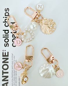 three different types of charms on top of a white background with the words fashion clips written below them