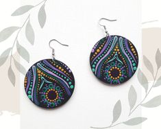 Original hand-painted earrings in this pattern made only once, very light to wear, colorful with a mandala motif, made with the intention of love. Made on a wooden disc (plywood). Diameter is 2 inches (5 cm), weigh 9 grams, painted with acrylic paints, painted dotart, protected by varnish. Stainless steel earwires. The back is black. I can make custom earrings in the colors you dream of with silver or gold-plated earwires (stainless steel). Who created them for you? My name is Karolina Kanimani, I follow the path of conscious development, I am passionate about nature and beauty and I LOVE to create. With joy and passion I create Mandalas from the Heart space, giving each an individual intention. I trained on courses to create Mandalas as a symbol of the Wheel of Life. I invite you to my In Multicolor Hand Painted Jewelry For Festivals, Multicolor Peacock Design Earrings As Gift, Multicolor Peacock Design Earrings For Gift, Hand Painted Round Jewelry For Festivals, Purple Hand Painted Bohemian Earrings, Bohemian Hand Painted Purple Earrings, Hand Painted Multicolor Circular Jewelry, Bohemian Hand Painted Round Jewelry, Mandala Inspiration