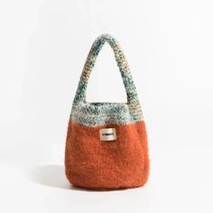 Add a touch of coziness to your style with the Multicolor Knitted Bucket Bag. The soft-touch knit material and plush texture make it a perfect handbag for casual and comfy occasions. Soft touch knit material Plush texture Handbag Size: length 16cm (6.2inc) width 5cm (1.9inc) height 20cm (7.8inc) Strap size: height 14cm Bucket Bag Crochet, Knitted Purse, Kitsch Fashion, Green Contacts Lenses, Purple Contacts, Vest Style Women, Art Goals, Hip Hop Fashion 90s, Dilly Dally