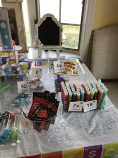 the table is set up with candy and candies for children to enjoy in their own home