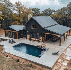 an aerial view of a house with a pool and hot tub in the middle of it