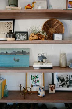 some shelves with pictures and other items on them