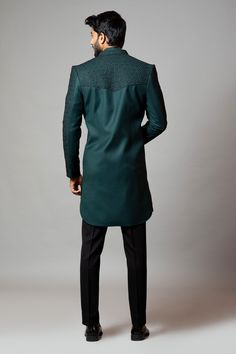 Emerald green straight-cut sherwani with honeycomb motif all-over cutdana work. Comes with short kurta and slim fit contrast trousers.
Component: 3
Embroidered
Neckline: Mandarin Collar
Sleeve Length: Sherwani: Full
Fabric: Sherwani: Suiting; Kurta: Linen; Trousers: Suiting
Color: Green
Concealed placket kurta
Seam pockets - Aza Fashions Green Sherwani, Black Slim Fit Trousers, Cutdana Embroidery, Short Kurta, Green Trousers, Indian Wedding Wear, Western Look, Embroidered Neckline, Black Trousers