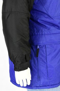 "Royal blue with contrasting black on the shoulders, sleeves, & zipper pulls. Polyfill. Elasticized cuffs. 6 outside front zip pockets. Inside waist adjuster . Great pre-owned vintage, however, the coat is missing its zip-off hood. Estimated Modern Size: XL *Vintage clothing runs significantly smaller than modern clothing. We offer a comprehensive size estimation in accordance with modern-day size charts. Vintage Tag Size: XL Material: nylon Lining: synthetic Closure: zip, velcro, & snap Winter Blue Windbreaker With Zipper Closure, Blue Streetwear Outerwear With Side Pockets, Blue Windbreaker With Pockets For Cold Weather, Blue Functional Track Jacket For Winter, Blue Functional Winter Track Jacket, Blue Winter Windbreaker With Pockets, Blue Sports Outerwear With Zipper Closure, Sporty Blue Windbreaker With Zipper Closure, Sporty Blue Outerwear With Zip Fly