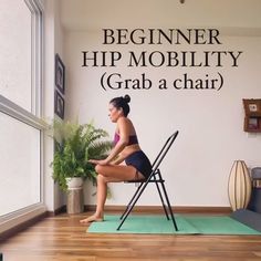 a woman sitting on top of a chair in front of a wall that says beginner hip mobility grab a chair