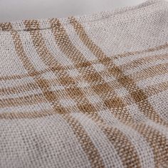 the fabric is made up of brown and white squares