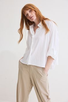 The Poplin Oversized Cropped Blouse is a contemporary twist on a classic wardrobe staple. Crafted from premium poplin fabric, this blouse effortlessly combines comfort, style, and versatility to elevate your everyday look Elegant Spring Poplin Tops, Elegant Poplin Tops, Oversized Elegant Cotton Blouse, Relaxed Fit Poplin Top For Work, Modern Oversized Button-up Blouse, Versatile Cotton Blouse For Work, Versatile Solid Color Shirt For Daywear, Chic Daywear Poplin Blouse, White Long Sleeve Poplin Tops