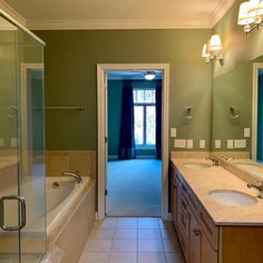 a bathroom with two sinks and a bathtub