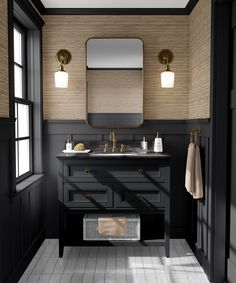 a black and white bathroom with two sinks