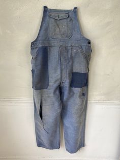 Hello and welcome to the Textile Trunk! Please follow us on Instagram, we are @textiletrunk As hipster as they get! Rustic, primitive wear ~ This textile is a lovely pair of vintage French overalls!! The top straps are all missing, but these are still a lovely treat! Made from a beautiful heavy weight indigo denim moleskin! ~~ These overalls date to the 1940s or a bit earlier~ There are two front pockets at the waist, and a button pocket on the bib. ~ lovely for creative hands to add some straps Vintage Denim Blue Jeans With Pockets, Vintage Cotton Jeans With Pockets, Vintage Denim Blue Bib Front Overalls, Vintage Denim Blue Overalls With Pockets, Retro Blue Jeans With Pockets, Vintage Dark Wash Bottoms With Patch Pockets, Blue Distressed Cotton Overalls, Blue Cotton Distressed Overalls, Vintage Blue Jeans With Patch Pockets