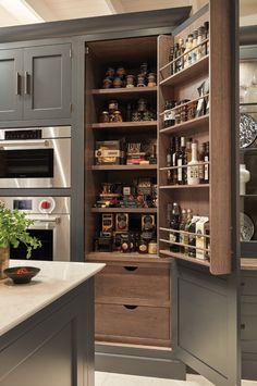 an open pantry in the middle of a kitchen