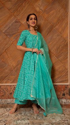 _PRODUCT DESCRIPTION:__ Kurt (Anarkali): Cotton Pants: Cotton Dupatta: Organza No. Of Components : Set of 3 Length of anarkali: 48inches Length of pants: 38inches Length of dupatta: 2.50 meters Margin left: 2inches Product Highlights: Tassels at the back of anarkali and gotta lace work at the bottom ,neck & sleeves of anarkali and pants. Wash Care : _Dry Clean Customization : Only Size and Length Of Product SKU#: 11403048BL Disclaimer: All our pieces are handcrafted in our manufacturing unit .We Navratri Reception Anarkali Set, Designer Wear Ankle-length Salwar Kameez With Cutdana, Navratri Maxi Length Churidar With Cutdana, Designer Chanderi Anarkali Set Ankle-length, Anarkali Set With Resham Embroidery, Ankle-length, Designer Ankle-length Cutdana Salwar Kameez, Navratri Churidar With Cutdana In Maxi Length, Designer Anarkali Set In Chanderi Fabric, Ankle-length Sharara With Zari Work For Diwali