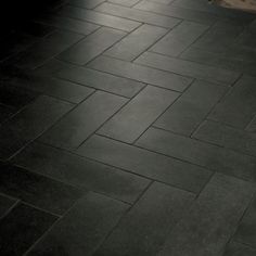 a black and white photo of a tile floor