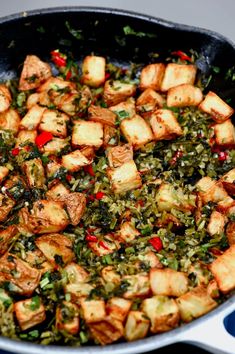 a pan filled with food sitting on top of a stove