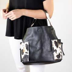 In love with adorable and summer fun cow print? We picked this set of bags just for you! The 'Wildest Dreams Cow Print Handbag' features two large exterior pockets, 11.5"h x 16"w, snap closure. The 'Wildest Dreams Crossbody Bag' measures 9"h x 10.5"w features an adjustable strap and interior pockets. The 'Wildest Dreams Cow Print Wallet' is only our most fierce wallet yet! When you pull this baby out of your bag, people will know you mean business! It measures 4"h x 8.5"w and features a zipper p Black Bag With Cow Print For Everyday Use, Trendy Cow Print Bags For Everyday Use, Casual Everyday Bag With Cow Print, Rectangular Cow Print Travel Bag, Casual Cow Print Bags For Daily Use, Embroidered Monogram, Printed Handbags, Wildest Dreams, Cow Print