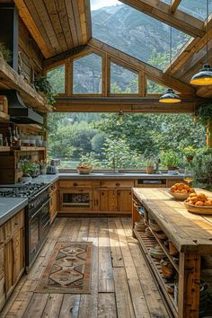 an outdoor kitchen with wooden floors and walls, windows on the ceiling, and lots of greenery