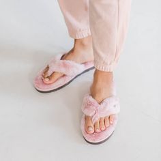 Slip into warmth and comfort with Pudus' new Carrie Flip Flop Slippers. Featuring memory foam inserts, anti-skid rubber soles, and luxuriously soft faux-fur lining, these fuzzy slippers offer superior comfort and foot support while relaxing at home. Keep your feet feeling cozy and warm all year long - whether you are cooking in the kitchen, stepping out of the shower, or relaxing with your newspaper. Materials 100% Recycled Polyester Care: Hand wash cold. Air Dry. • We don't recommend using fabr Cozy Faux Fur Slippers With Cushioned Footbed, Comfortable Flat Faux Fur Slippers, Comfortable Faux Fur Flat Slippers, Cushioned Slip-on Faux Fur Slippers, Comfortable Faux Fur Slippers With Cushioned Footbed, Comfy Faux Fur Slippers With Round Toe, Recycle Water Bottles, Fuzzy Slippers, Flip Flop Slippers