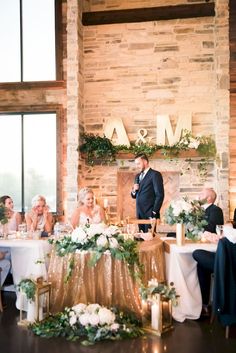 a bride and groom standing at the alter during their wedding reception