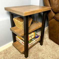 a wooden table with some books on it and a chair in the corner next to it