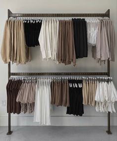 a rack with clothes hanging from it's sides