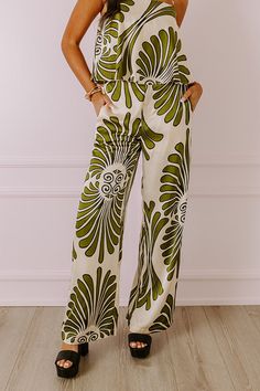 - Indulge yourself in luxe vibes with these sleek and stylish pants! - Material with an abstract print and a satin finish - Built-in shorts style lining - A waistline with an elastic back, a hidden zip fly, and double hook and eye closure - Functional side pockets - A relaxed silhouette that ends in wide hemlines Chic Green Satin Bottoms, Trendy Satin Bottoms For Summer, Chic Abstract Print Pants For Spring, Trendy Green Printed Pants, Chic Green Printed Bottoms, Green Printed Straight Pants, Stylish Pants, Shorts Style, High Waist Pants