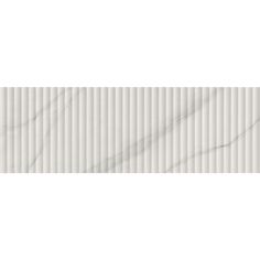 a white marble tile wall with vertical lines in the center and diagonal stripes on it