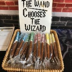 there is a sign that says the wands choose the wizard in front of it