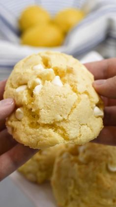 a person holding a cookie in their hand