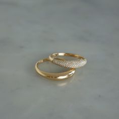 Bold is the way to go. Stacked or separate, these beautiful rings will do the talking for you.The Dome Duo Gift Set includes: The Gold Dome Ring: Keep it simple while making a statement in our 14k gold dome ring. The Diamond Dome Ring: With pavé diamonds and 14k gold, this dome ring takes style to new heights. $2,300 value which means you save 15% and a whole bunch of time since we did the styling for you. There’s something to be said about a solo moment, but we believe style should be stacked. Jewellery Rings Gold, Round Rings Gold, Dome Wedding Ring, Dome Gold Ring, Basic Gold Ring, Daily Ring Stack, Timeless Domed Wedding Rings, Gold Domed Ring With Brilliant Cut, 14k Gold Domed Jewelry For Wedding