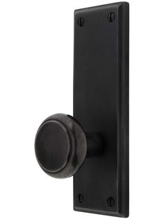 a black door handle with a round knob on an isolated white background, viewed from the front