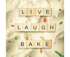 the words live laugh bake are spelled by scrabble letters on a white background