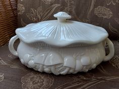 a white dish sitting on top of a couch