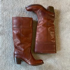 In Great Condition! Highly Sought After! A Womens Size 9. Cognac Tan Leather. I Believe They Are Called Redwood. Not Quite Knee High. Pull On. Gently Worn. There’s A Little Mark On The Back Of The Left Boot At The Top. You Have To Get Close Up To Notice It. I’m Not Sure What It Is But I’m Sure A Cobbler Could Shine Them Up Perfect. There’s No Damage To The Leather. Fall Leather Boots With Leather Backing, Leather Boots With Leather Backing For Fall, Brown Leather Trim Boots For Fall, Fall Cognac Boots With Leather Lining, Brown Leather Boots With Stacked Heel, Rustic Leather Boots For Fall, Rustic Boots With Leather Lining For Fall, Rustic Fall Boots With Leather Lining, Cognac Boots With Stacked Heel For Fall