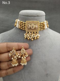 *Light Weight Gold Adjustable choker set with earrings  *Studded with crystal stone. *No.1-  *Necklace pendant length- 2 inches (Included drops) *Necklace pendant width- 1.6 inches *No.2-  *Necklace pendant length- 2.5 inches (Included drops) *Necklace pendant width- 1.7 inches Kundan Metal Choker For Wedding, Wedding Temple Jewelry Metal Choker, Metal Wedding Temple Jewelry Choker, Choker Set Gold, Ruby Choker, Jewellery Choker, Drops Necklace, Indian Gold Jewelry, South Indian Bridal Jewellery