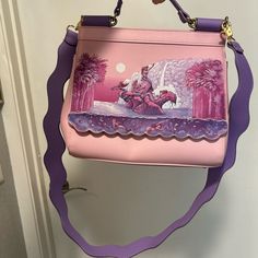 This Loungefly Disney Mermaid Lagoon Bag Is Pale Pink With Purple Straps And Gold Accents. It Is Lightly Used (2x) Happy To Answer Questions! Pink Loungefly Backpack, Pink Disney Loungefly, Disney Princess Loungefly, Peter Pan Mermaids, Loungefly Disney Princess Bag, Loungefly Disney Wallets, Mermaid Lagoon, Mermaid Disney, Loungefly Disney