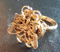 Stunning Vintage Butterfly Ring.  Band is gold in color and adjustable. Currently sized for 7.  Great workmanship. Very good condition.  Please remember this item is preloved, and may show signs of light wear. Stunning Vintage Butterfly Ring Gold Band Formal Gold Butterfly Ring, Unique Gold Filigree Ring For Wedding, Unique Gold Flower Ring For Anniversary, Adjustable Gold Flower Ring For Formal Occasions, Gold Open Ring Filigree For Formal Occasions, Gold Open Filigree Ring For Formal Occasions, Vintage Gold Butterfly Ring Gift, Vintage Gold Flower Promise Ring, Gold Filigree Open Ring Gift