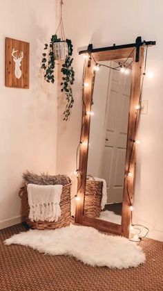 a room with a mirror, rug and lights on the wall next to a bed